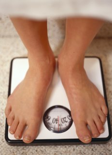 Feet standing on a scale