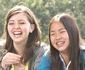 Two girls laughing.